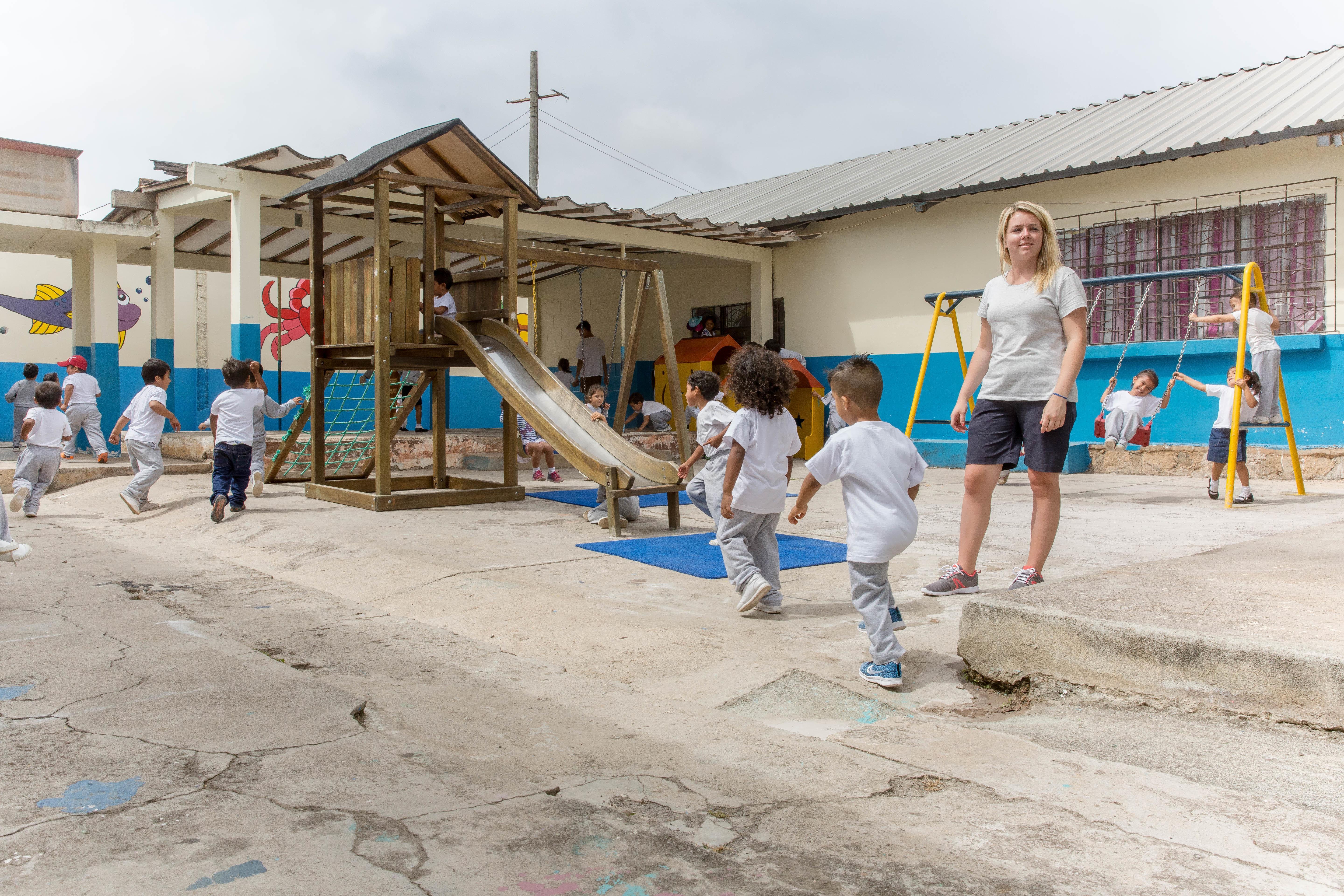 A Projects Abroad intern surpervises children during playtime at her Social Work placement in Ecuador An intern gains social work experience in Ecuador working with local children